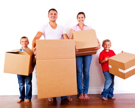 Professional movers carrying furniture during a Heston house move