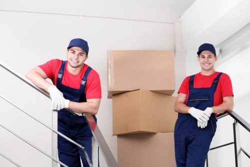 Local moving team handling boxes and furniture for a Heston home move