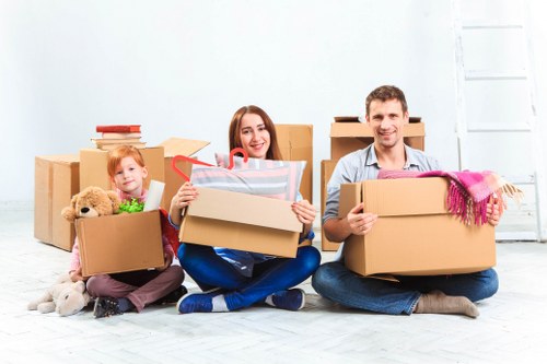 Local moving team handling furniture and boxes in Heston