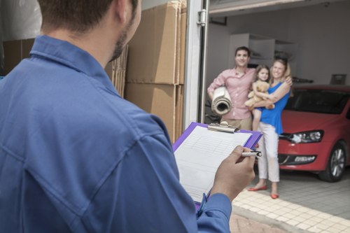 Moving van and packed boxes for a local removals service in Heston