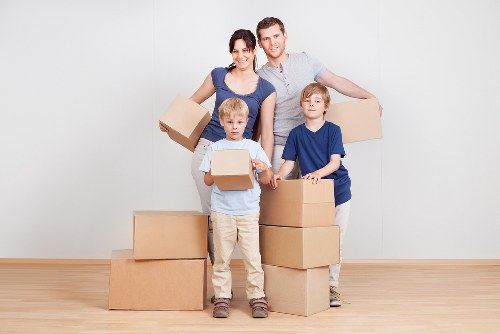 Packed boxes and furniture ready for transport in Heston