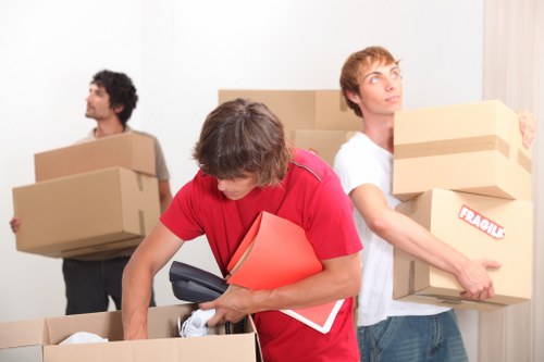 Household items and boxes being transported by a local van service