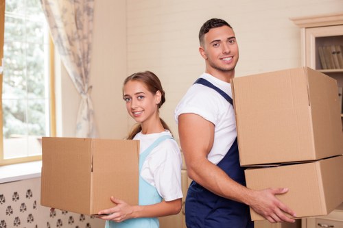 Professional team handling office furniture and equipment during a Heston move