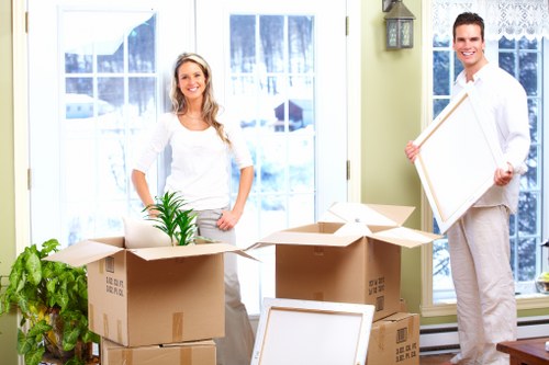 Loading furniture into a van for a move in Heston