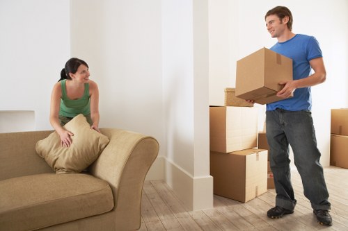 Local removal team planning a home move in Heston with packing materials